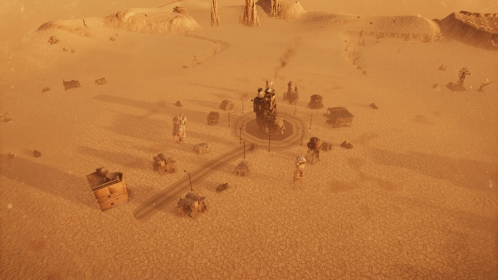 The town at golden hour, long shadows across the cracked ground